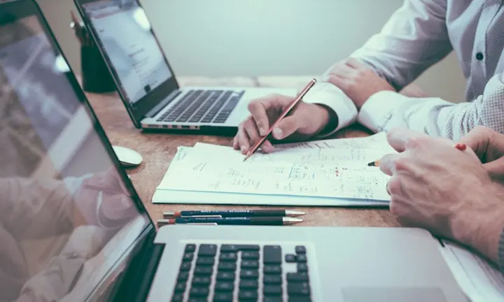 Business professionals reviewing financial information